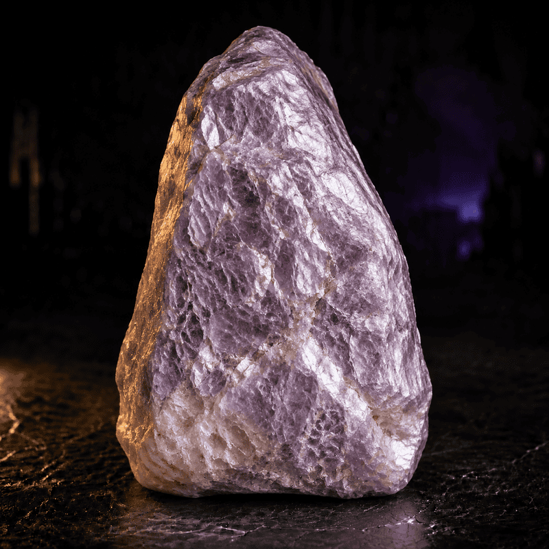Himalayan salt rock illuminated with purple and warm lighting.