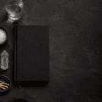 Modern Witchcraft Supplies: What Beginners Actually Need 5 Elegant workspace with candle, notebook, and natural elements for relaxation.